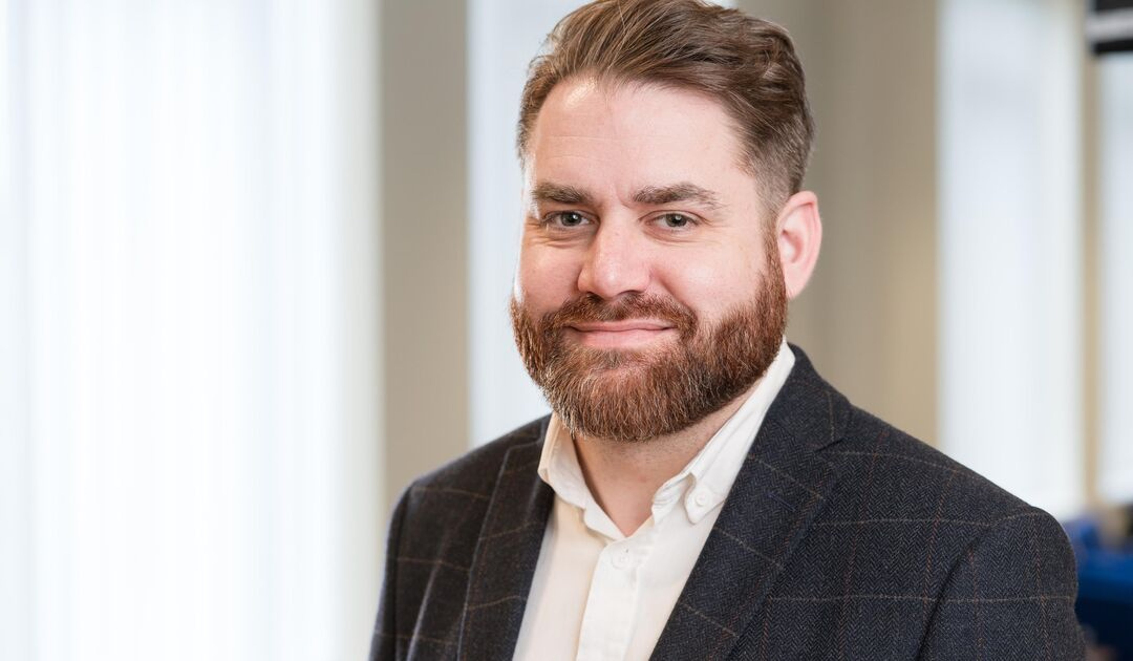 A headshot of Grant Saunders