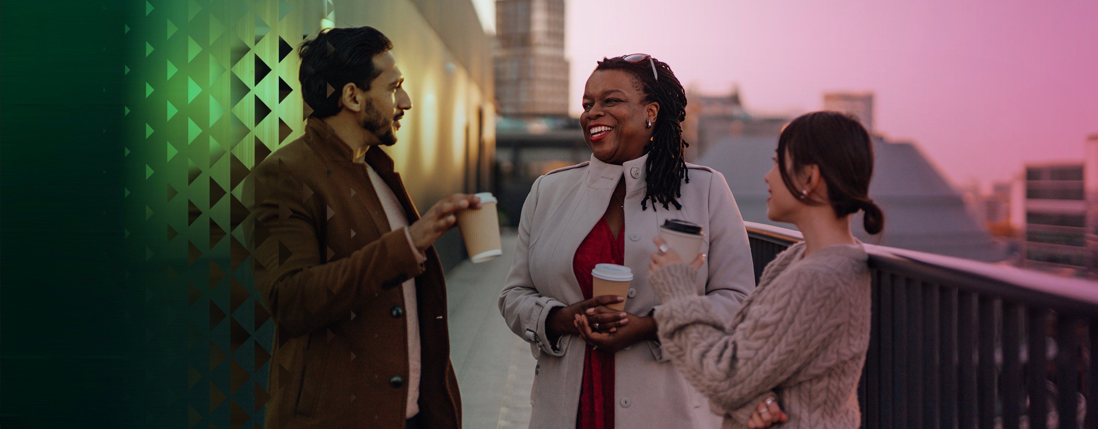 Three people talking and smiling