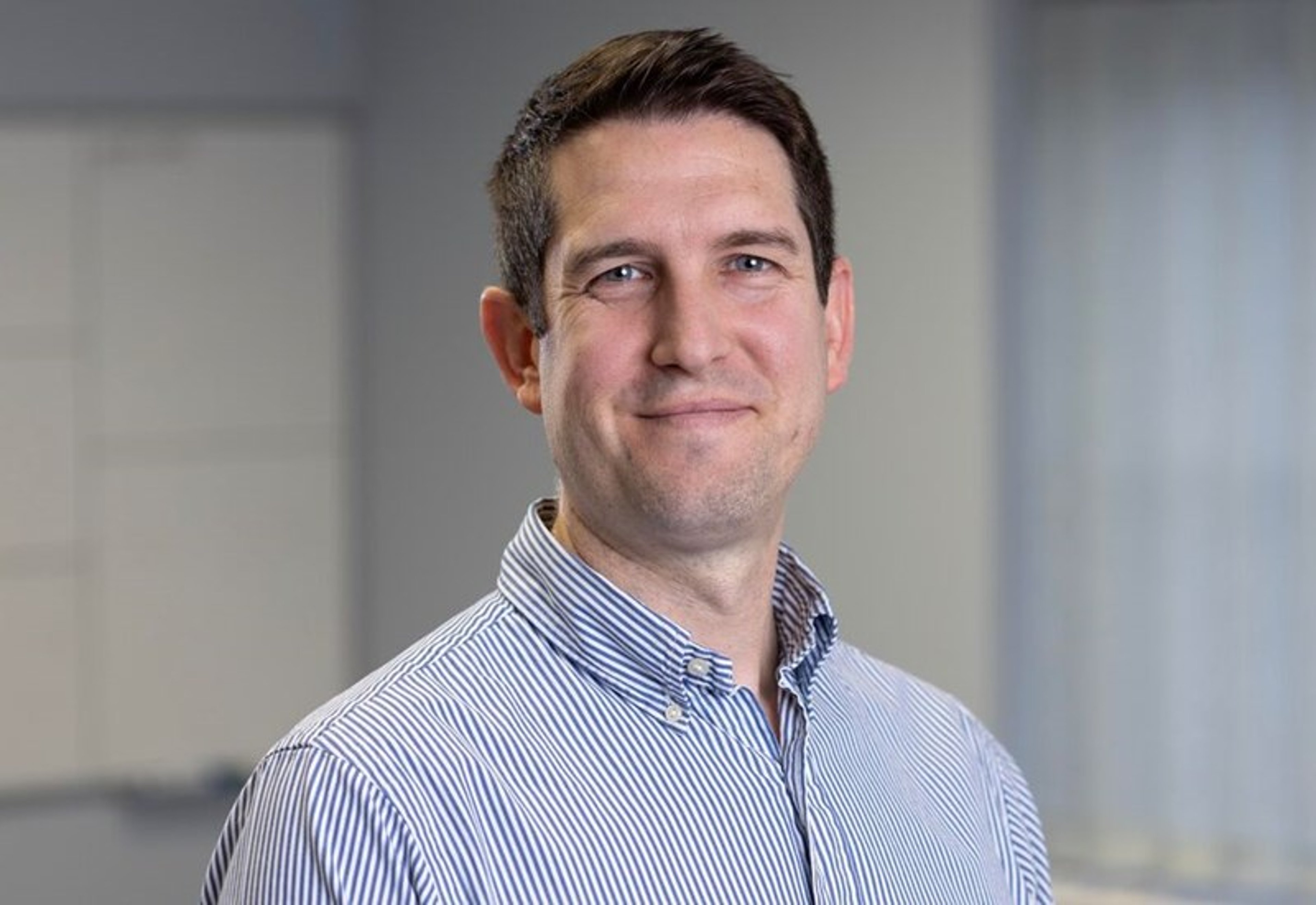 A headshot of Jon Shepheard