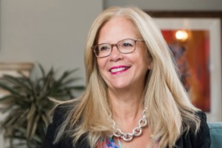 A headshot of Melanie Richards CBE